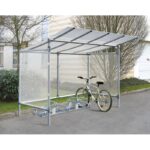Photo d'un vélo accroché à un support sous un abri vélos économique 5 places