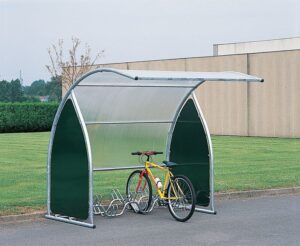 Photo d'un vélo jaune accroché à un support vélo sous un abri 6 vélos / motos / scooters