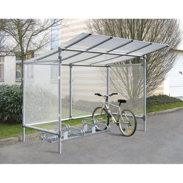 Photo d'un vélo gris accroché à un support vélos emplacements décalés galva 6 places sous un abri vélos