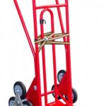 Photo d'un diable spécial escalier 250kg rouge roues caoutchouc avec brancard amovible